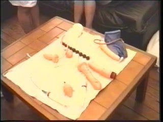 Doctor shoves various items up brunette’s wet pussy